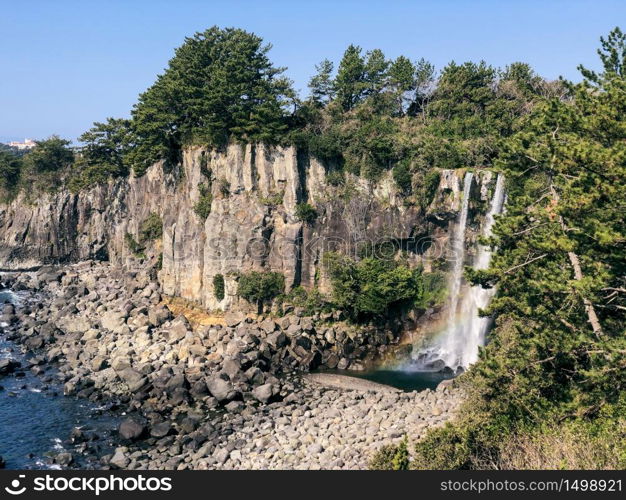 The high waterfall Jeongbang in Jeju island. South Korea