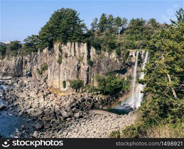 The high waterfall Jeongbang in Jeju island. South Korea