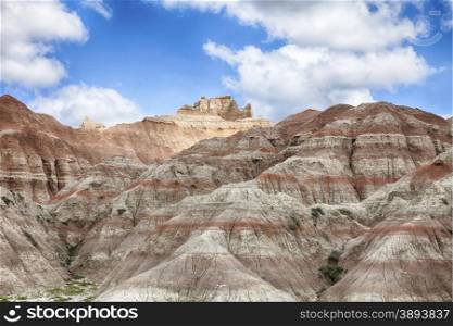 The hills in the South Dakota Badland are created from erosion through layers of soft rock and mud. The hills look much larger than they really are.