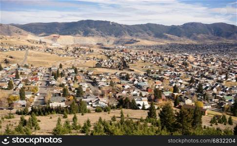 The hillside home and downtown of Butte Montana with winter setting in