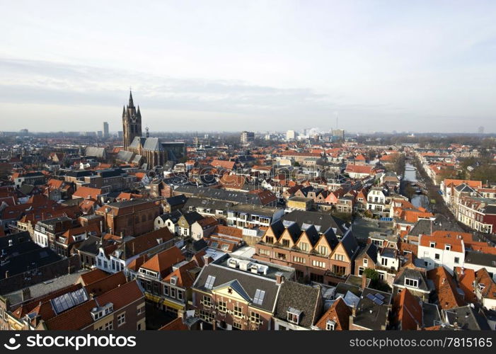"The historic university city of Delft, the netherlands, with the old church and "het Prinsenhof in clear view on the left"