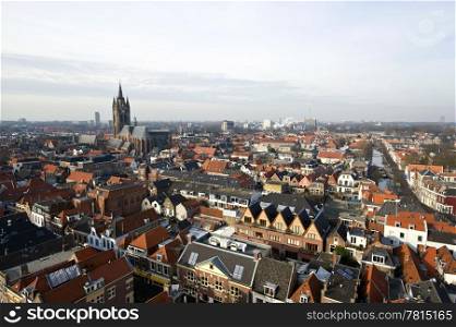 "The historic university city of Delft, the netherlands, with the old church and "het Prinsenhof in clear view on the left"