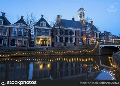 The historical village Dokkum in christmas time in the Netherlands at twilight