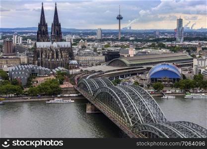 The Hohenzollern Bridge and Cologne Cathedral in the industrial and university city of Cologne situated on the River Rhine in Germany.