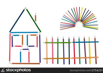 The house, fence and the sun from color pencils. It is isolated on a white background. Abstract concept