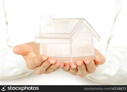 The house in human hands on white
