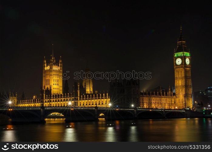 The Houses of Parliament, Big Ben and Westminster Bridge over the River Thames, London, England at Night
