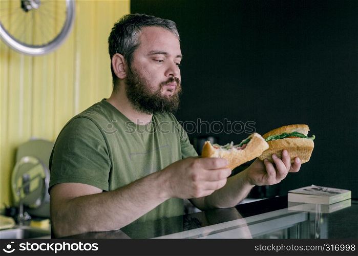 the hungry man who eats a sandwich
