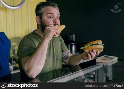 the hungry man who eats a sandwich