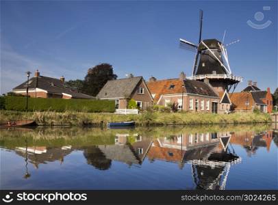 The Hunsingo windmill in Onderdendam. The Hunsingo windmill along the Boterdiep canal in the Dutch village Onderdendam