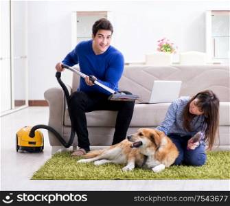 The husband cleaning house from dog fur. Husband cleaning house from dog fur