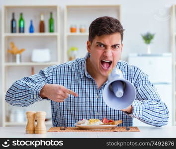The husband with loudspeaker yelling at his wife. Husband with loudspeaker yelling at his wife