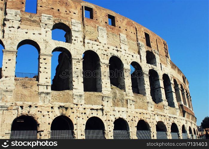 The iconic ancient Colosseum of Rome , Italy. The iconic ancient Colosseum of Rome