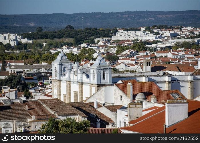 the igreja de Santo Antao at the Parca do Giraldo Square in the old Town of the city Evora in Alentejo in Portugal. Portugal, Evora, October, 2021