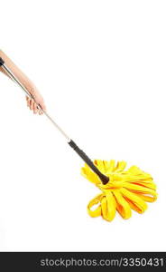 The image of a yellow mop in a hand, isolated