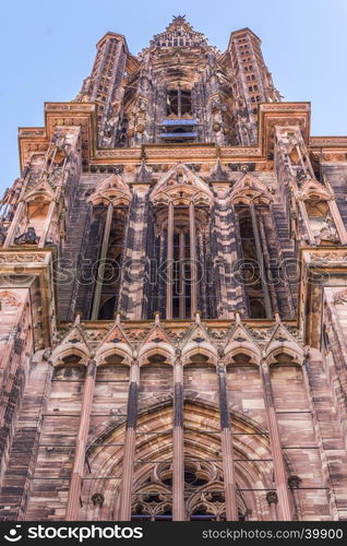 The impressive bell tower of the Notre Dame cathedral from Strasbourg, France. Famous for its architecture and the fact that it's the 6th tallest church in the world