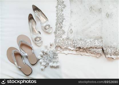 The indian bridea??s shoes and saree in white.. Indian Wedding Saree and The Bride Shoes
