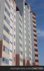 The inhabited high house against the blue sky