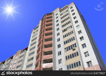 The inhabited high house against the blue sky