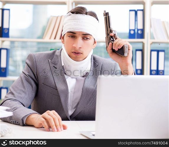 The injured businessman working in the office. Injured businessman working in the office
