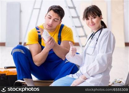 The injured worker being assisted by doctor. Injured worker being assisted by doctor