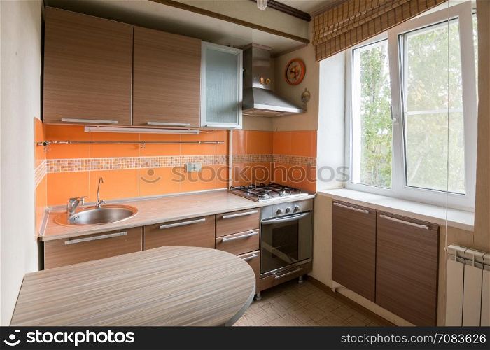 The interior of an empty kitchen equipment for sale