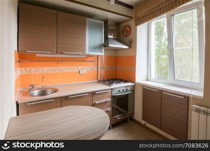 The interior of an empty kitchen equipment for sale