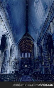 The Interior of the Cathedral in St Hubert, Belgium. Saint Hubrt&rsquo;s Church art and structure inside the church at night.