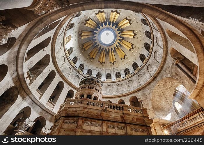 The interior of the Church of the Holy Sepulchre in the Old City of Jerusalem is illuminated by the light from the dome overhead