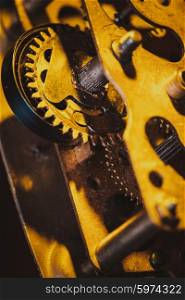 The internal design of the mechanical and rusty clock in a larger view. Vintage clock mechanism