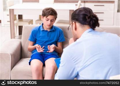 The internet addicted boy visiting male doctor . Internet addicted boy visiting male doctor 