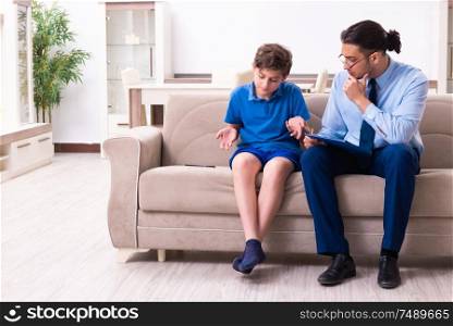 The internet addicted boy visiting male doctor . Internet addicted boy visiting male doctor