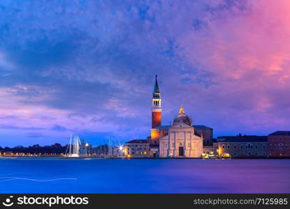 The island and the church of San Giorgio Maggiore seen across the water at sunrise, Venice, Italy.. San Giorgio di Maggiore at sunrise, Venice, Italy