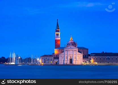 The island and the church of San Giorgio Maggiore seen across the water at night, Venice, Italy.. San Giorgio di Maggiore at sunrise, Venice, Italy