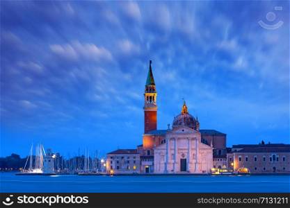 The island and the church of San Giorgio Maggiore seen across the water at night, Venice, Italy.. San Giorgio di Maggiore at sunrise, Venice, Italy