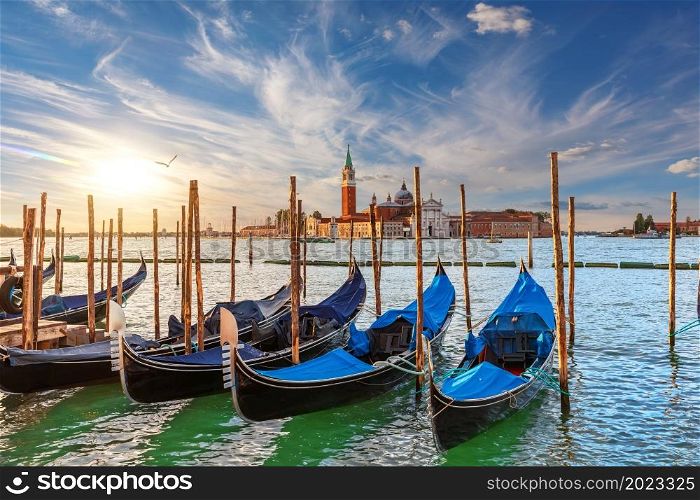 The island of San Giorgio Maggiore and traditional gondolas of Venice, Italy.