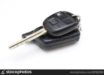 The key from the car with buttons lies is isolated on a white background