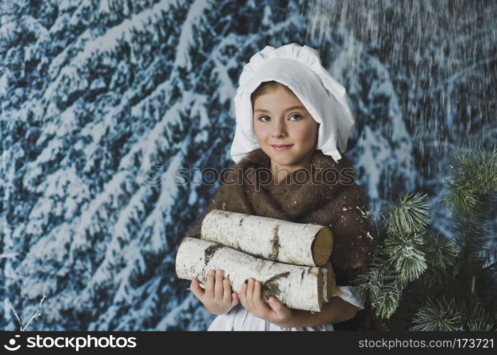 The kid in the white cap in winter forest.. The girl in the white cap among the bushes in the frost 4841.