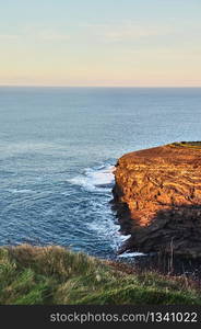 The Kilkee Cliff walk is a scenic 2 to 3 hour 8km moderate loop walk along the Kilkee Cliffs starting at the Diamond Rocks Cafe , Pollock Holes car park.. Sunny Cliffs of Kilkee in Ireland county Clare Sunset. Tourist destination