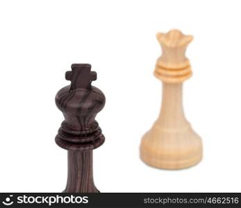 The king and queen faced. Wooden chess pieces isolated on a white background