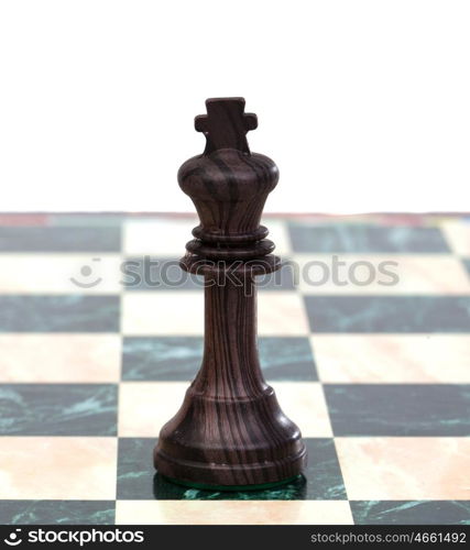 The king. Wooden chess piece isolated on white background