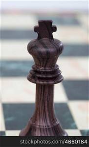The king. Wooden chess piece on chessboard