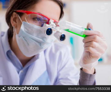 The lab assistant in drug synthesis concept. Lab assistant in drug synthesis concept
