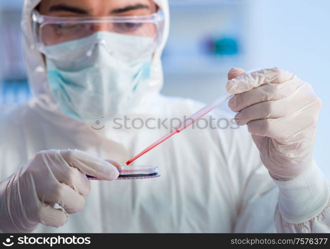 The lab assistant testing blood samples in hospital. Lab assistant testing blood samples in hospital