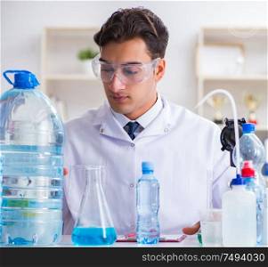 The lab assistant testing water quality. Lab assistant testing water quality