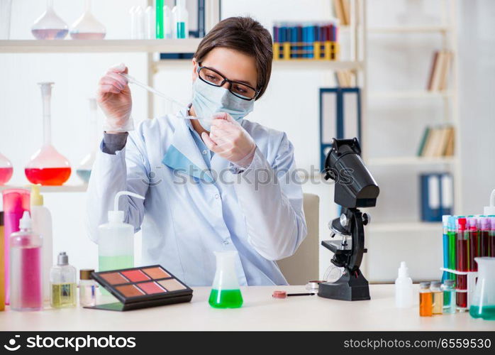 The lab chemist checking beauty and make-up products. Lab chemist checking beauty and make-up products