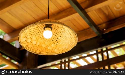 The lamp hanging from a ceiling.