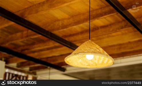 The lamp hanging from a ceiling.
