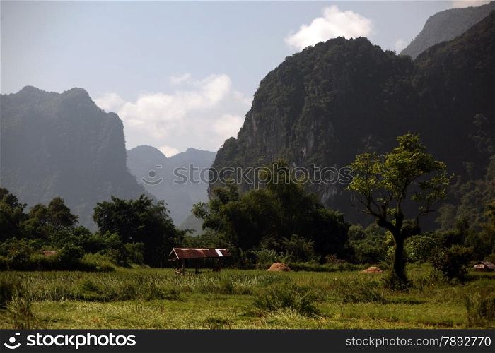 the Landscape near the Village of Kasi on the Nationalroad 13 on the way from Vang Vieng to Luang Prabang in Lao in southeastasia.. ASIA LAO VANG VIENG LUANG PRABANG