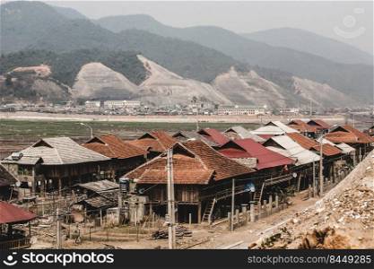 The landscape of the Ban Chat hydropower plant, Tai ethnic ancient villages rebuilt on a construction site. Vietnam.